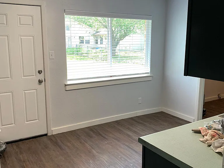 Kitchen with large window facing the backyard