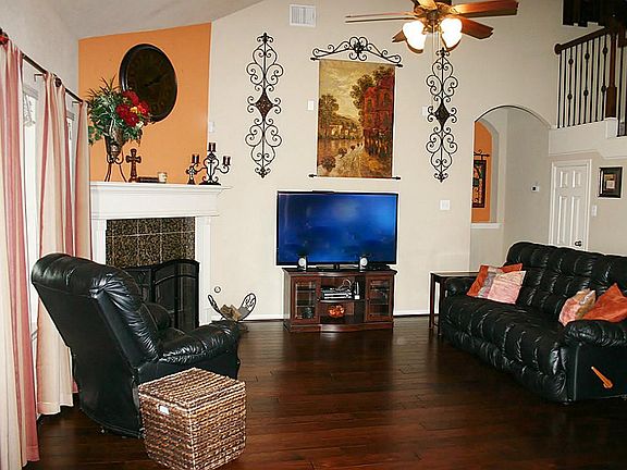 Den has recent wood floors and is overlooked by the stairs and upstairs landing. Secluded Master Bed