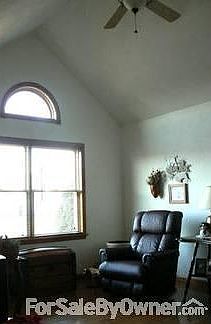 Living Room : The cathedral ceiling adds light and space. A ceiling fan circulates the air.
