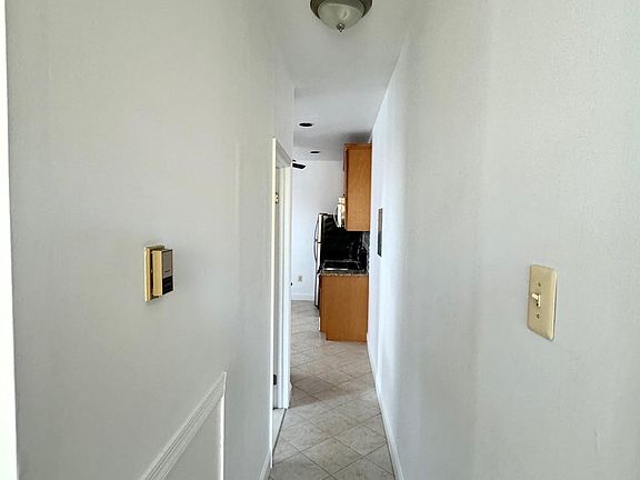 Hallway w/ceramic tile flooring