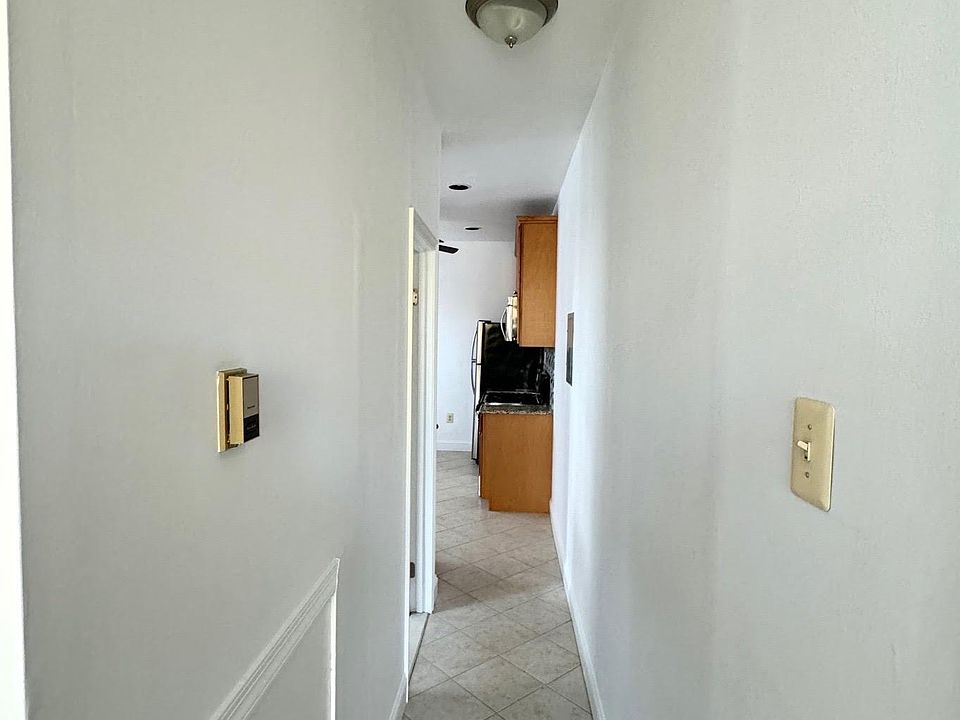 Hallway w/ceramic tile flooring