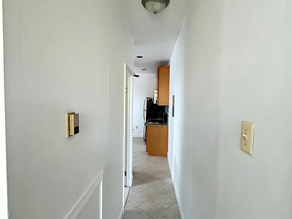 Hallway w/ceramic tile flooring