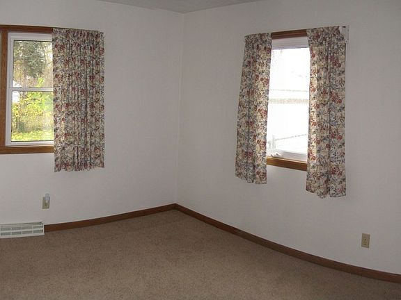 Master bedroom with corner windows.