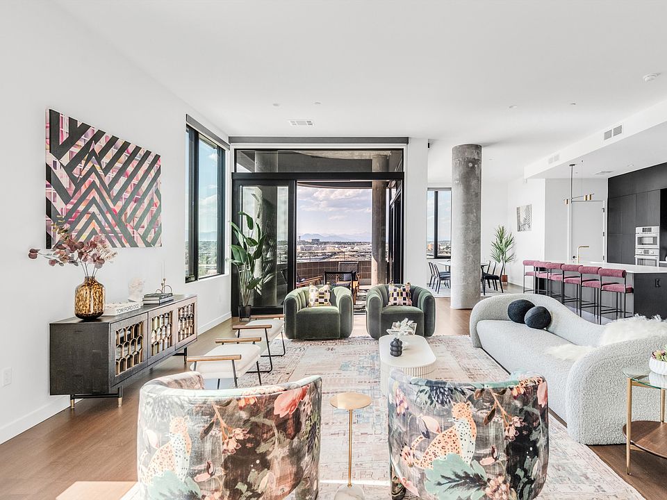 Beautiful open living room with kitchen and mountain views from our largest Penthouse.