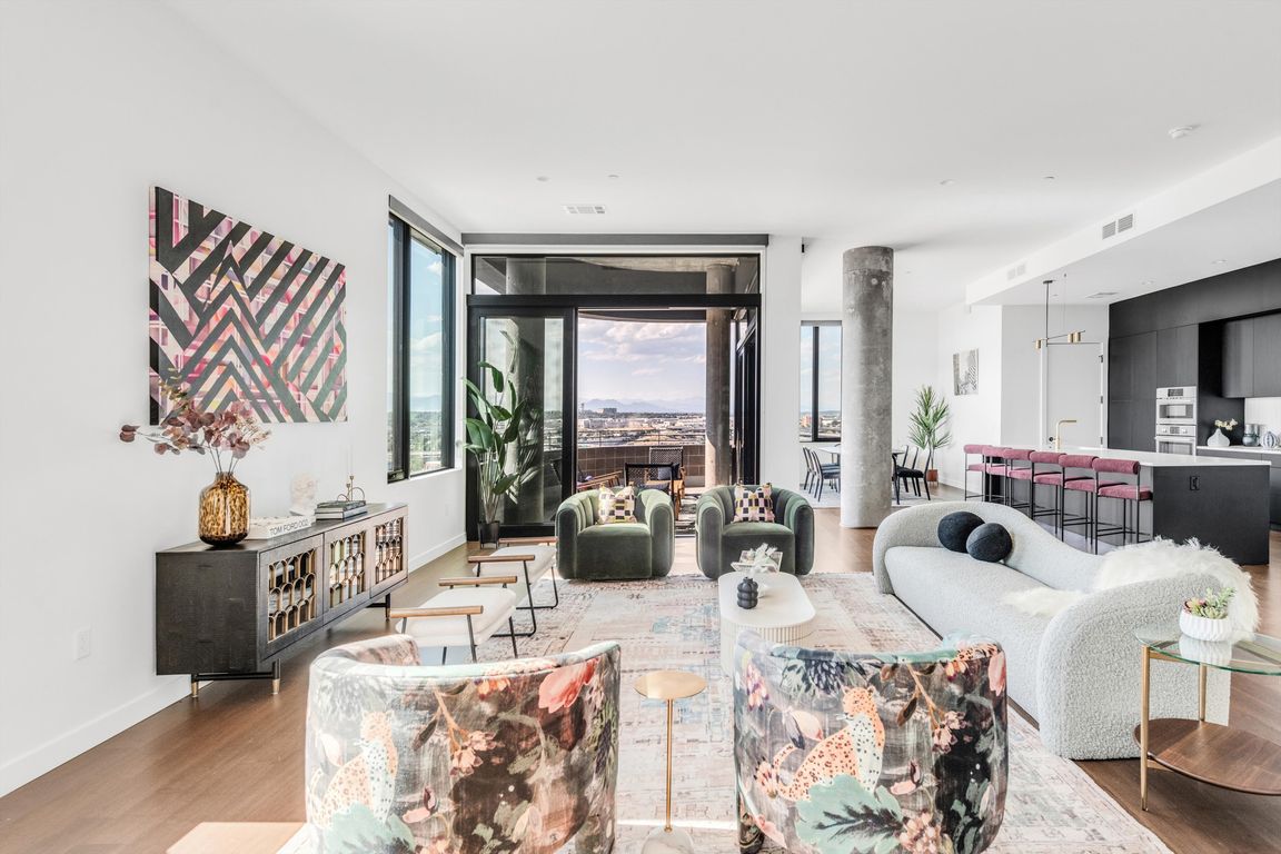 Beautiful open living room with kitchen and mountain views from our largest Penthouse.
