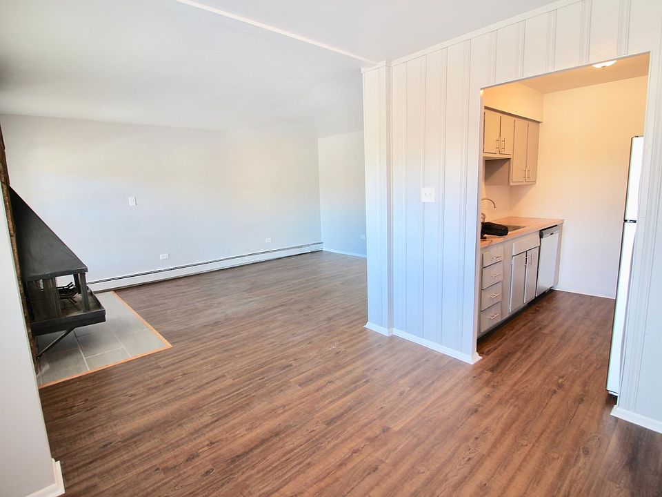 View of main living area and kitchen from dining room.