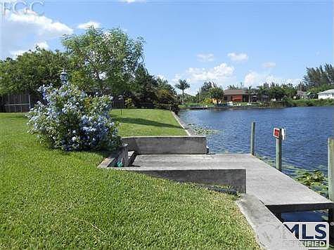 At the corner of the property. Over 150ft on the water with seawall already in place.  Cement dock has water and electric.