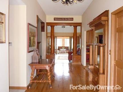 Picture of kitchen taken from foyer.
						:
						Remodeled with large pantry, granite countertops, new SS range,microwave,& DW.