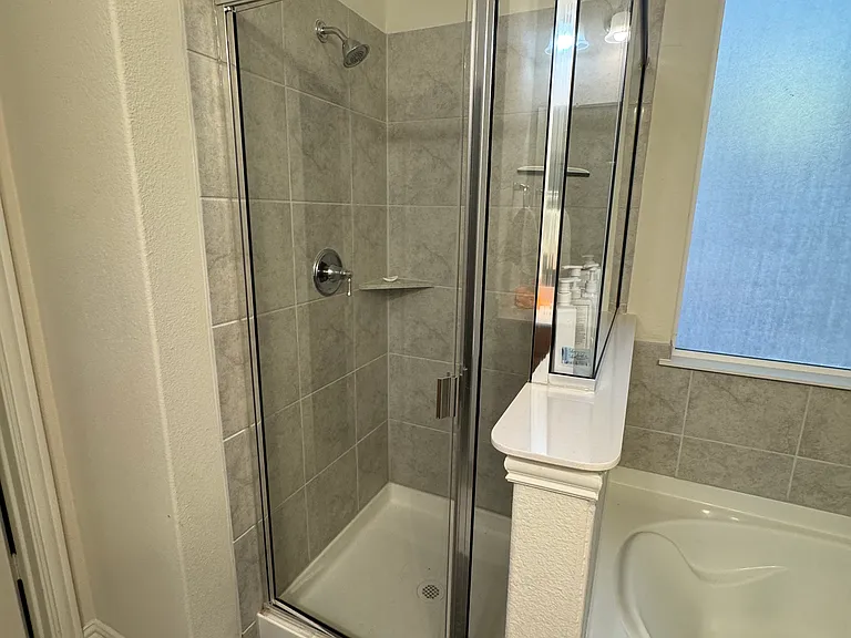 Main bathroom with seperate shower and tub areas.