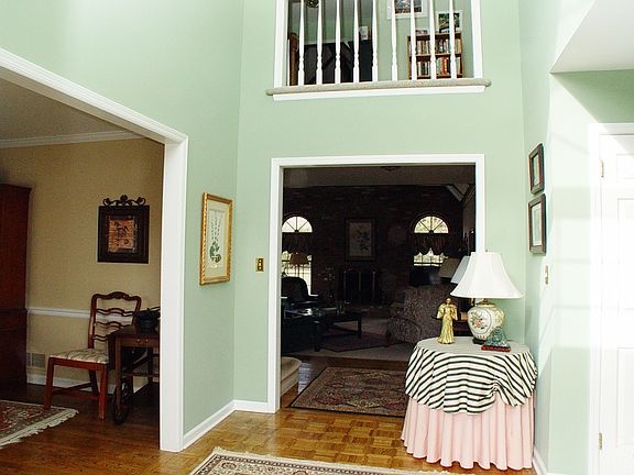 The two-story foyer has hard