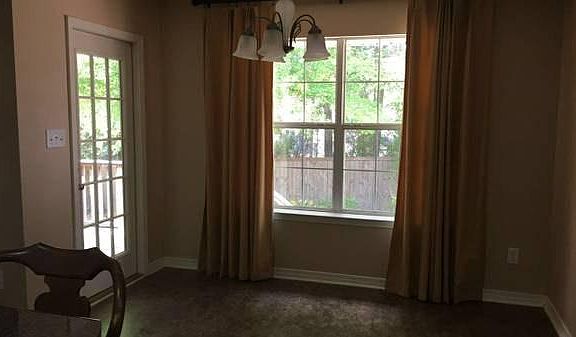 Dining room w/ door leading to back yard