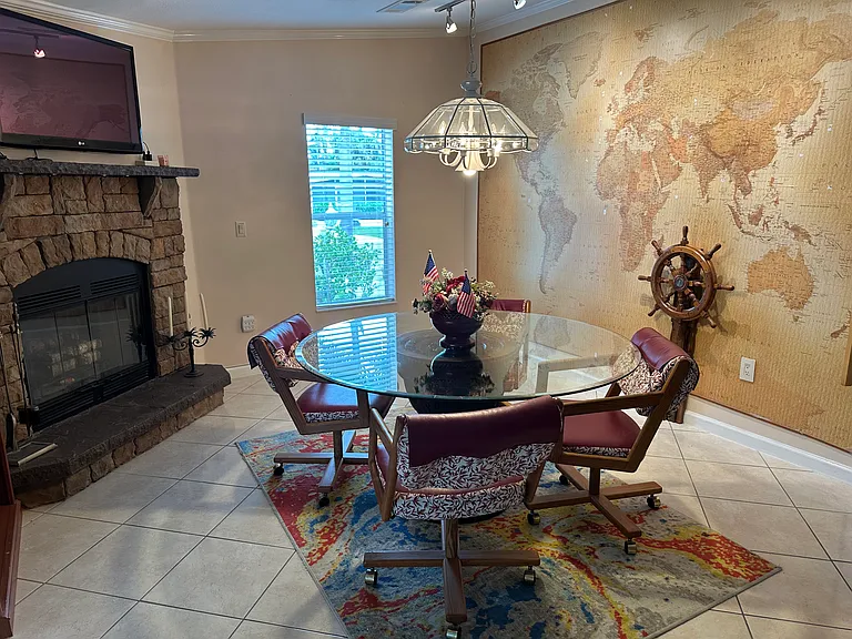 Kitchen dining area with World map wall and fireplace!