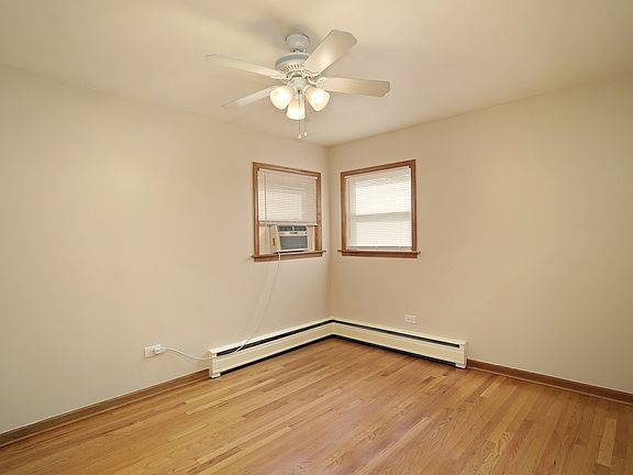 Hardwood floors and ceiling fan.