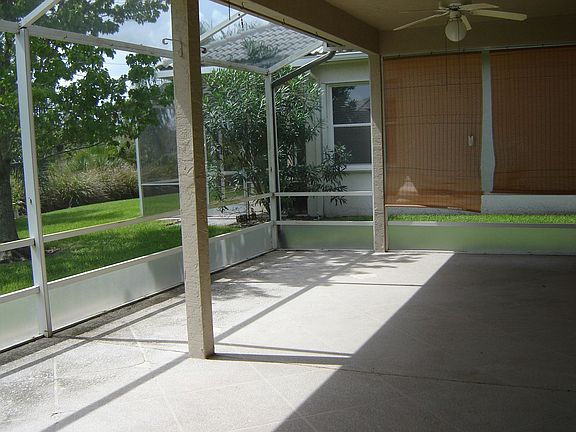 SCREENED AND ROOF COVERED PATIO!!
