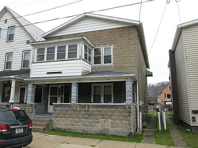 Exterior Front. Solid Concrete block duplex