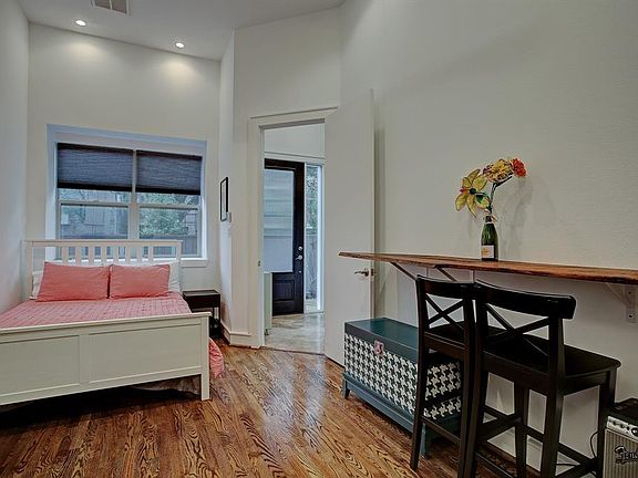 First floor bedroom with built in shelving and window bench