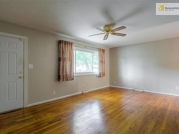 Spacious living room with large picture window.