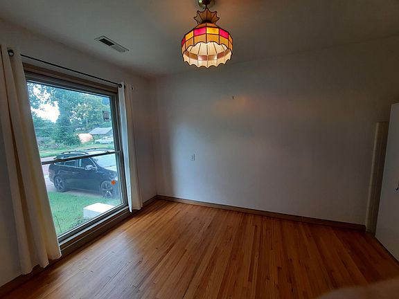 Dining room with full length window.