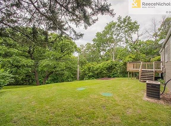 This large yard is very private and beautifully treed.