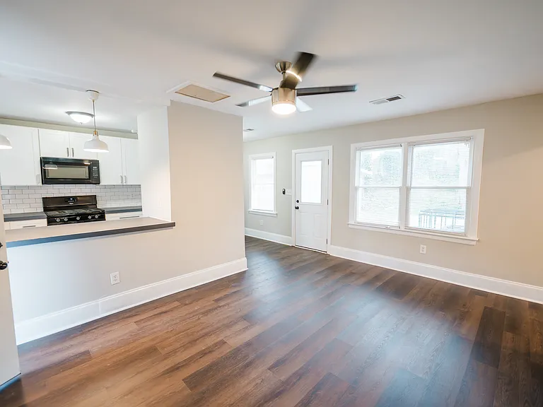 Comfortable living space flows into open kitchen. Perfect for entertaining guests.