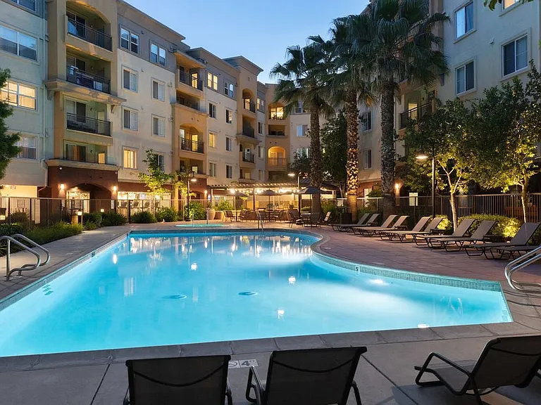 Swimming pool and sundeck with lounge seating