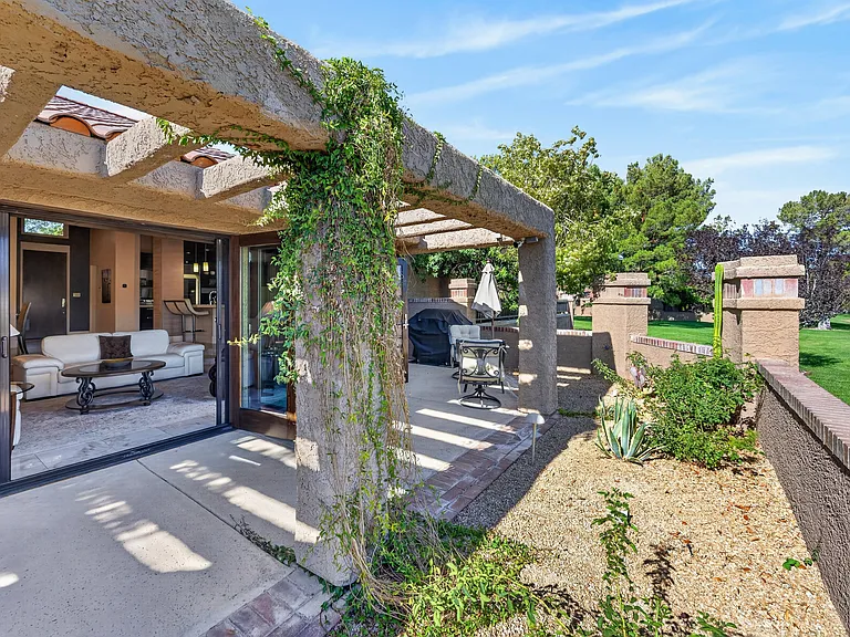 Patio during daylight with french doors open to the living room