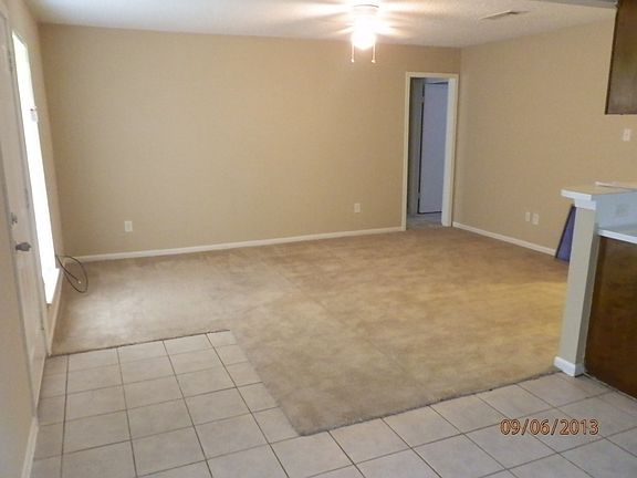 Spacious Family Room with Carpet and Tile