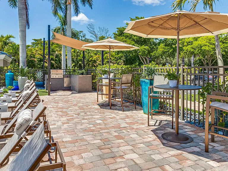 Immerse yourself in the joy of cooking at our poolside outdoor kitchen, a delightful al fresco culinary adventure.