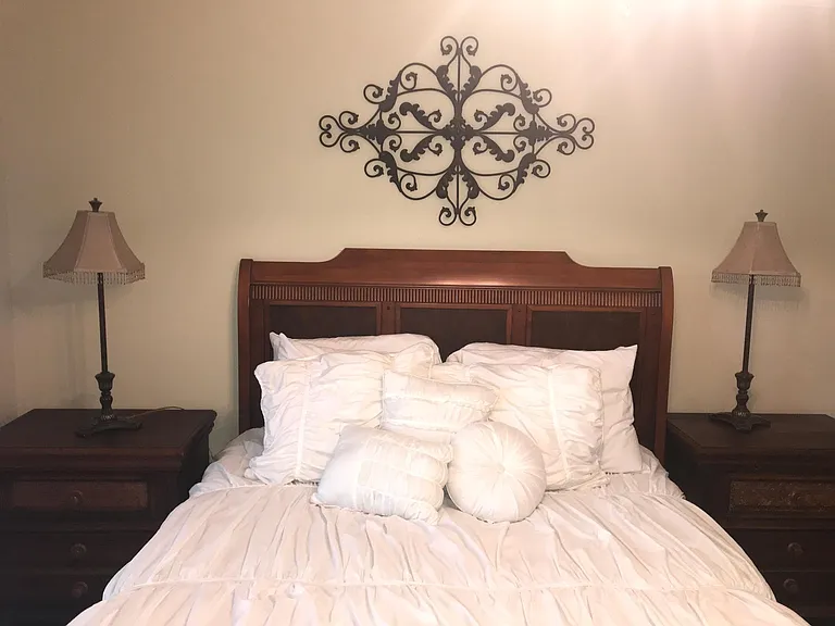 Second bedroom has queen bed set with two nights stands and smart TV