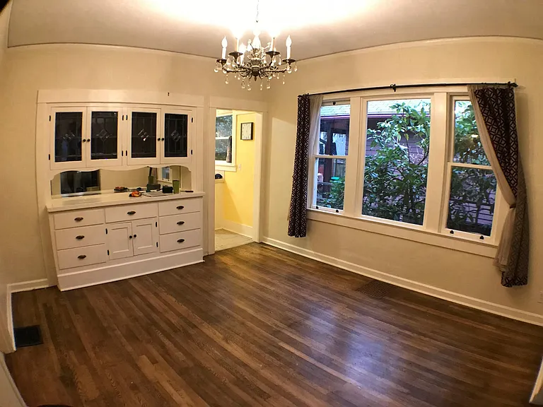 Dining room with original built-in cabinets.