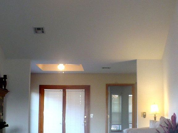 Living room with vaulted ceiling, remote controlled ceiling fan