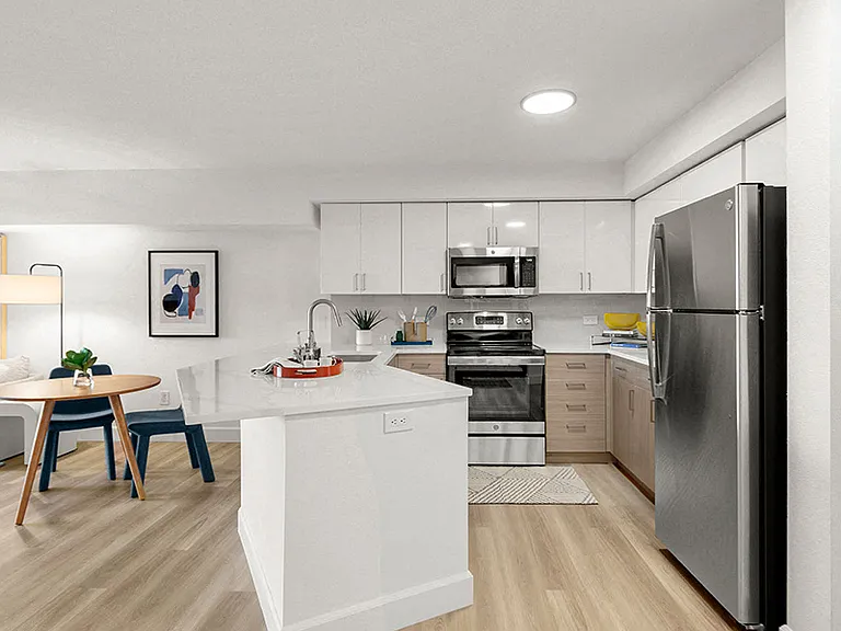 Two-toned white and wood-grain flat front cabinets