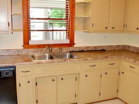 Kitchen has dishwasher and ample cabinet storage.
