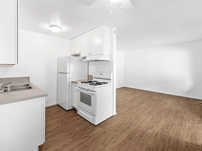 Kitchen view, dining and living room