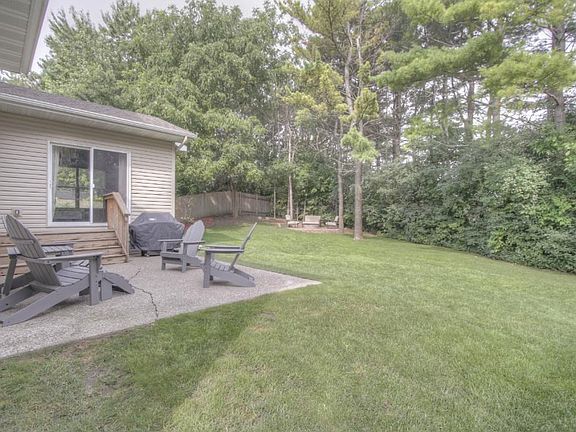 Tree lined backyard.