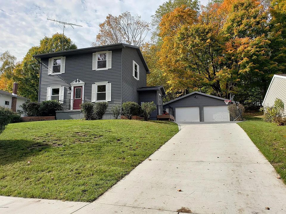 Front of house, driveway, and garage.