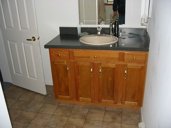 Vanity in master bath, also whirlpool tub.
