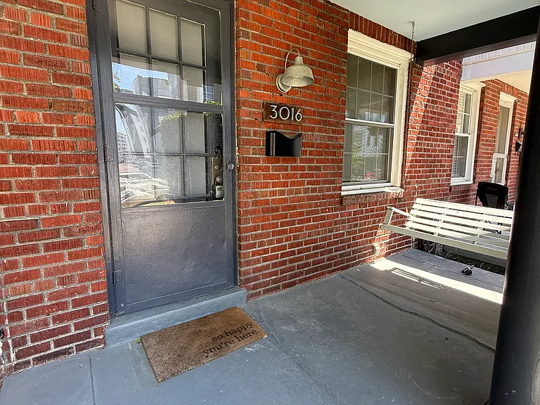 Wonderful covered front porch with swing.