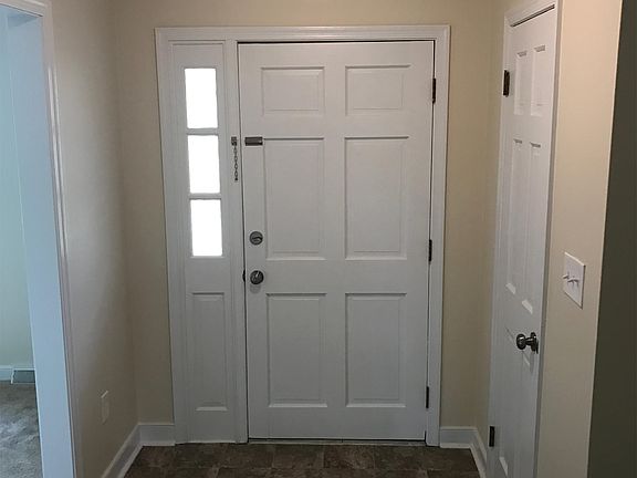 New quality flooring, light fixture and fresh paint in Entry