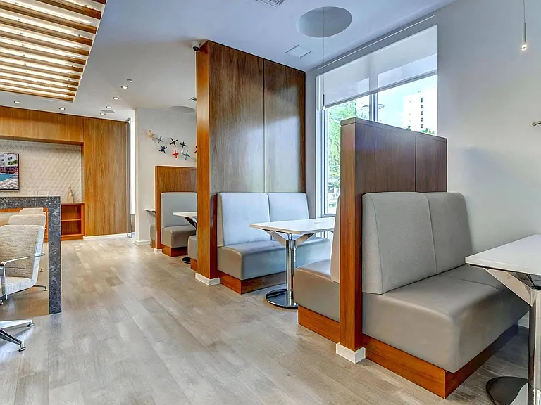 Community Lounge with Private Booth Seating and Shared Workspace