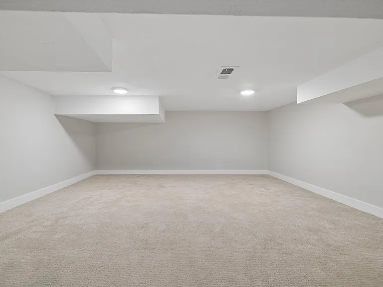 Basement book nook for kids or extra storage space from brown stairs in previous photo