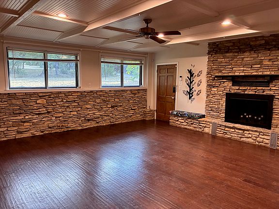 Family den area- there is an entrance from the front of house into this room, as well as the living room. Beadboard ceiling. Huge room, could also be used as a 3rd bedroom or office, has a sliding door that closes it off from the kitchen area.