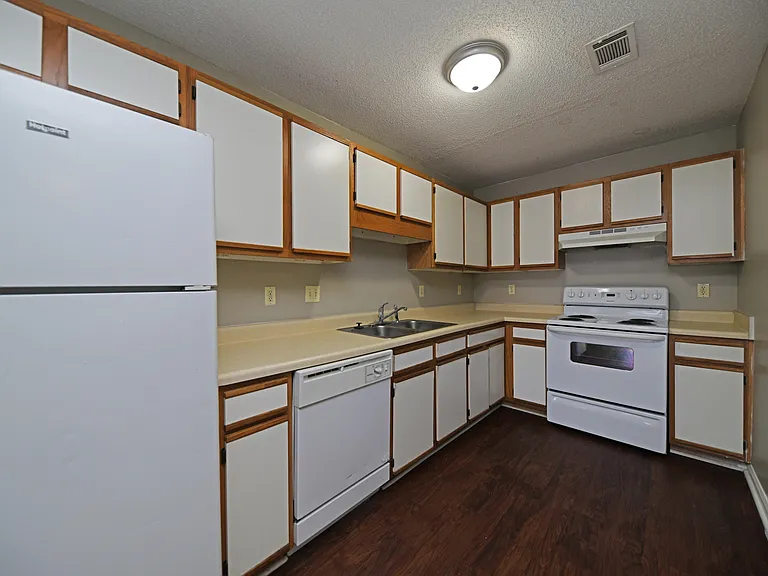 Kitchen area with ample cabinetry & counter space