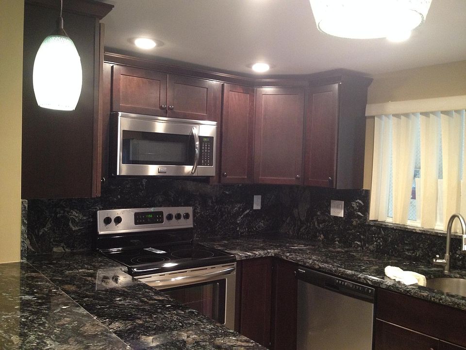 Beautiful new cherry wood cabinets with granite counter tops