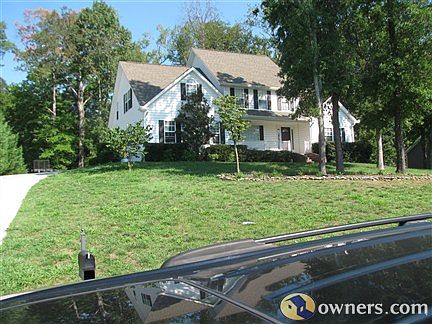 Side view with driveway & yard