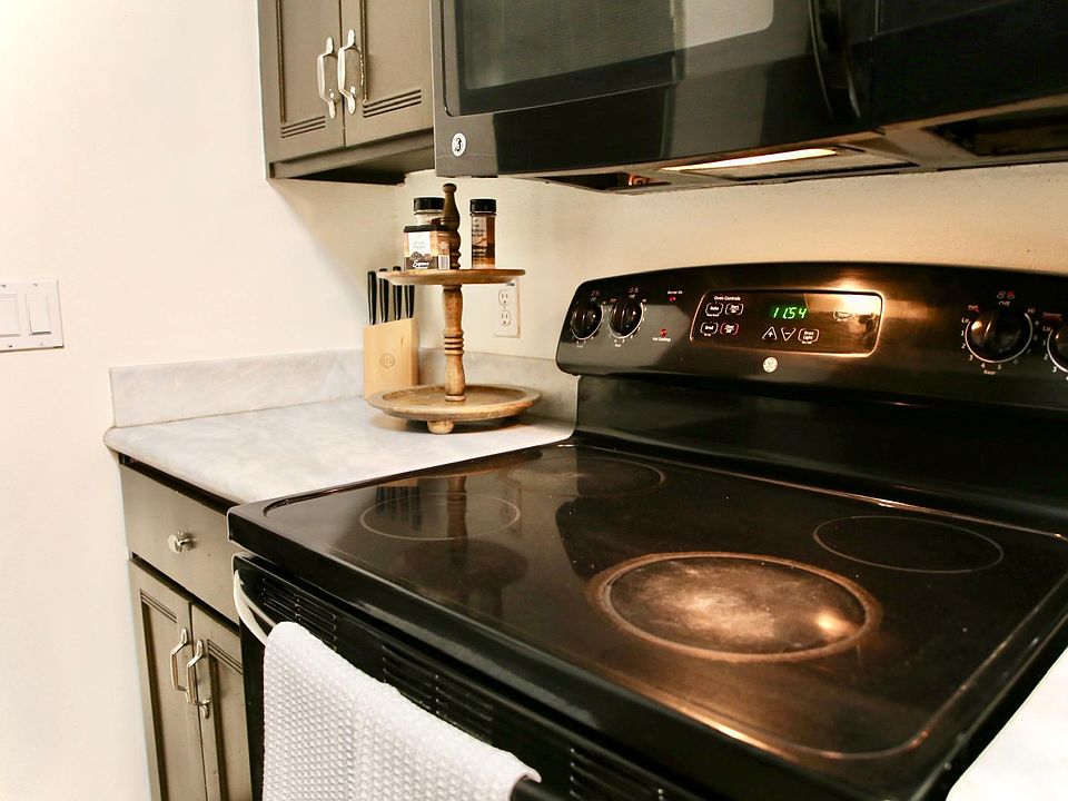 Comes with kitchen appliances. Stove, Microwave and Refrigerator.