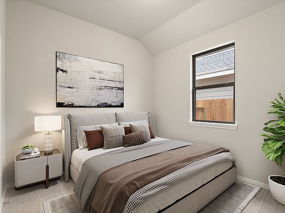 The third bedroom features plush carpet, fresh paint, closet, and a large window that lets in plenty