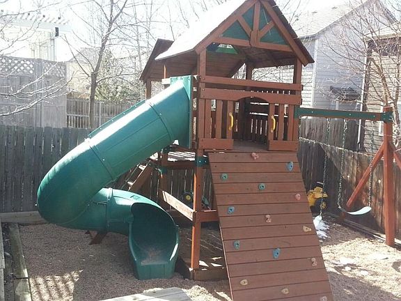 Private play structure in backyard.
