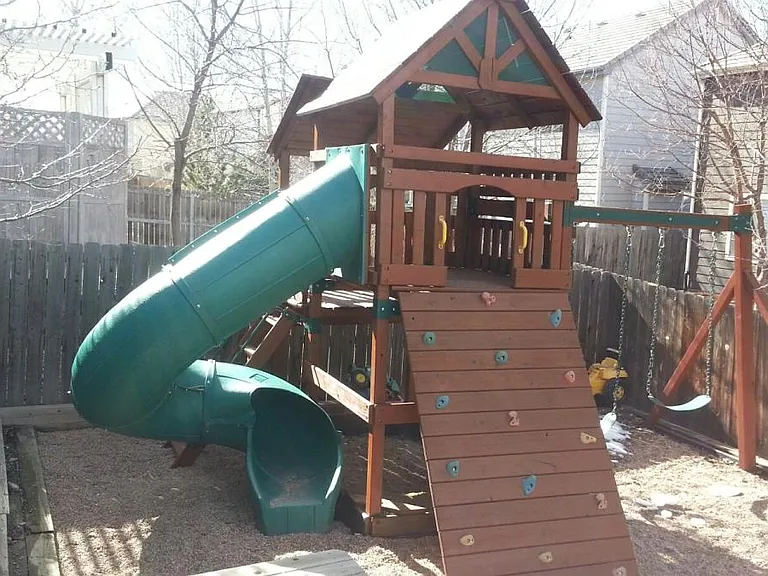 Private play structure in backyard.