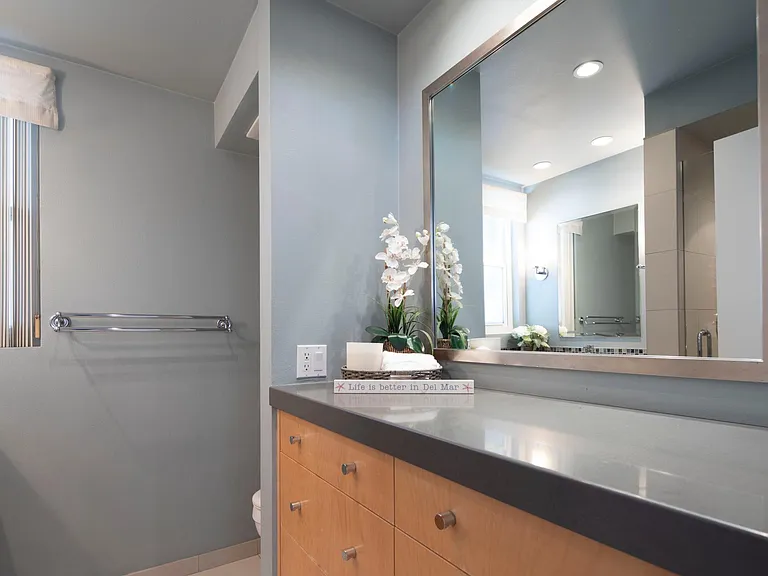 Downstairs bathroom that is located next to the guest bedroom with the queen bed.